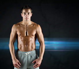 Image showing young male bodybuilder with bare muscular torso