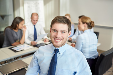 Image showing group of smiling businesspeople meeting in office