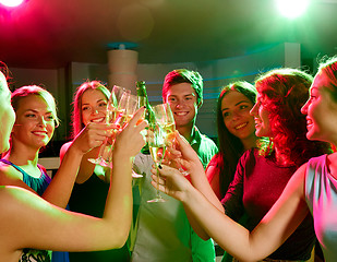 Image showing smiling friends with wine glasses and beer in club