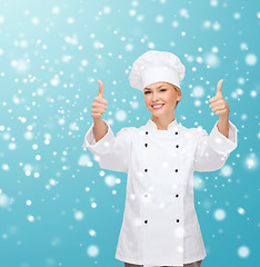 Image showing smiling female chef showing thumps up