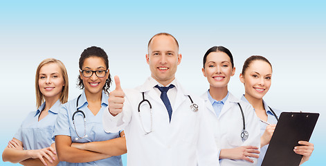 Image showing group of smiling doctors with showing thumbs up