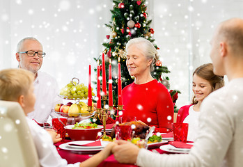 Image showing smiling family having holiday dinner at home