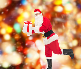 Image showing man in costume of santa claus with gift box