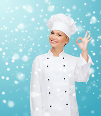 Image showing smiling female chef showing ok hand sign