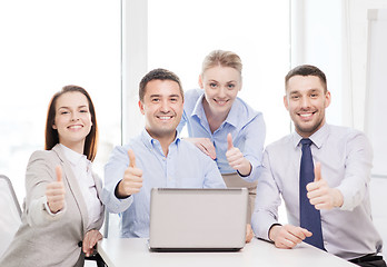 Image showing business team working with laptop in office