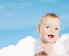 Image showing close up of mother holding smiling baby