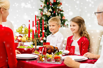 Image showing smiling family having holiday dinner at home