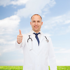 Image showing smiling doctor with stethoscope showing thumbs up