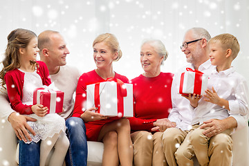 Image showing smiling family with gifts at home