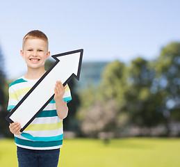 Image showing smiling little boy with blank arrow pointing right