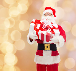 Image showing man in costume of santa claus with gift boxes
