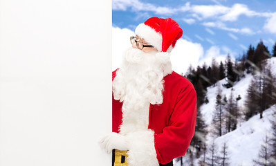 Image showing man in costume of santa claus with billboard