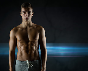 Image showing young male bodybuilder with bare muscular torso