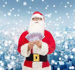 Image showing man in costume of santa claus with euro money