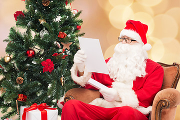 Image showing man in costume of santa claus with letter