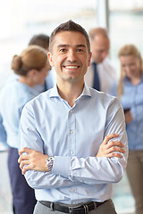 Image showing group of smiling businesspeople meeting in office