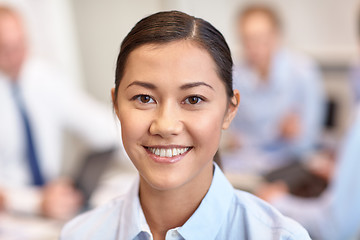 Image showing group of smiling businesspeople meeting in office