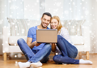 Image showing smiling happy couple with laptop at home
