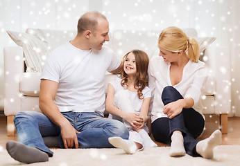 Image showing smiling parents and little girl at home