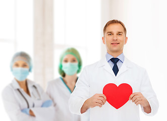 Image showing smiling male doctor with red heart