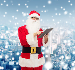 Image showing man in costume of santa claus with tablet pc