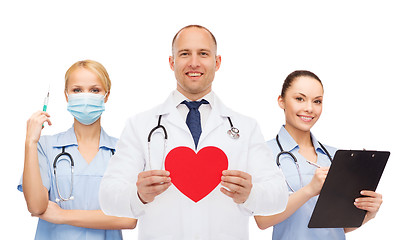 Image showing group of smiling doctors with red heart shape