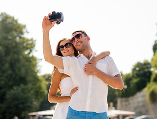 Image showing smiling couple in city