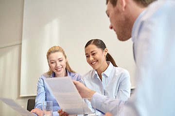 Image showing group of smiling businesspeople meeting in office