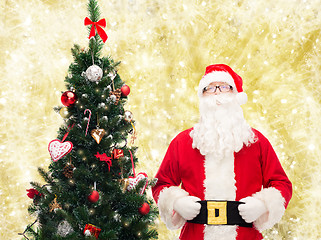 Image showing man in costume of santa claus with christmas tree