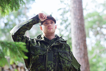 Image showing young soldier or ranger in forest