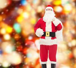 Image showing man in costume of santa claus with bag