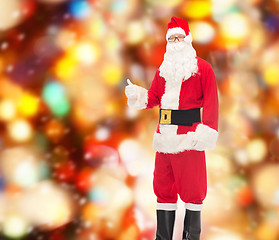 Image showing man in costume of santa claus showing thumbs up