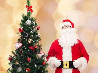 Image showing man in costume of santa claus with christmas tree