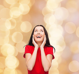 Image showing smiling woman in red dress