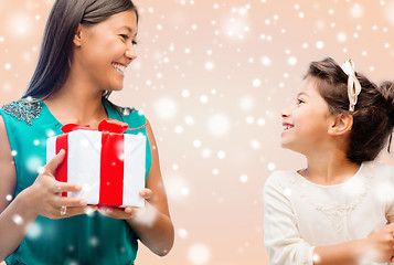 Image showing happy mother and child girl with gift box