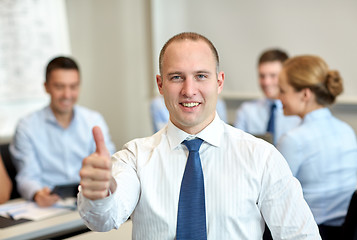 Image showing group of smiling businesspeople meeting in office