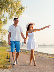 Image showing smiling couple walking outdoors