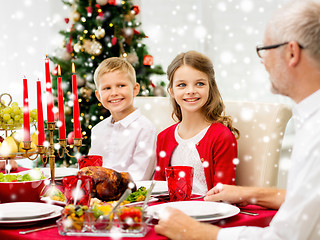 Image showing smiling family having holiday dinner at home