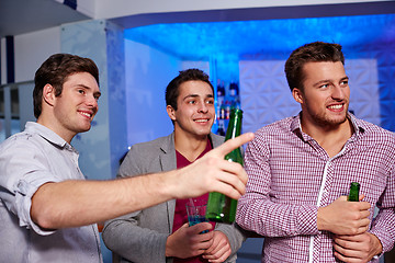 Image showing group of male friends with beer in nightclub