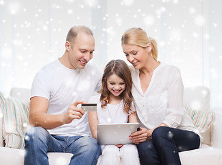 Image showing happy family with tablet pc and credit card