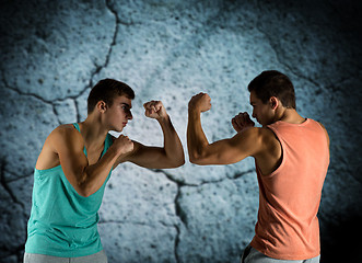 Image showing young men fighting hand-to-hand