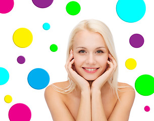 Image showing beautiful young woman over polka dot background