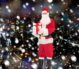 Image showing man in costume of santa claus with gift box