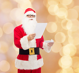 Image showing man in costume of santa claus with letter