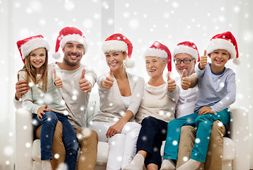 Image showing happy family sitting on couch at home