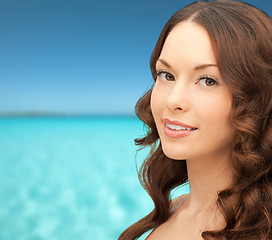 Image showing beautiful young woman over blue sky and sea