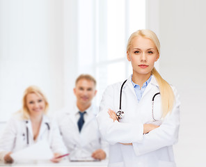 Image showing serious female doctor with stethoscope