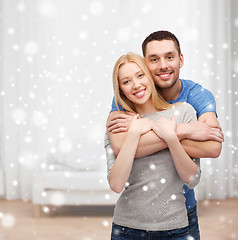 Image showing happy couple hugging at home