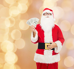 Image showing man in costume of santa claus with dollar money