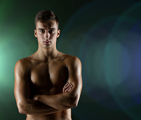 Image showing young male bodybuilder with bare muscular torso